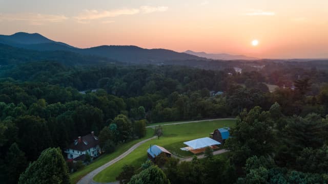 Sunrise aerial view of Engadine Inn and Cabins and the surrounding Blue Ridge Mountains. Sunrise aerial view of Engadine Inn and Cabins and the surrounding Blue Ridge Mountains.