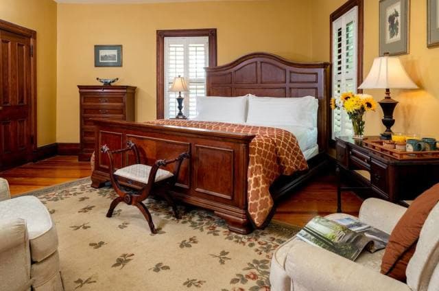 Historic inn suite with period furnishings at Engadine Inn and Cabins near Asheville. Historic inn suite with period furnishings at Engadine Inn and Cabins near Asheville.
