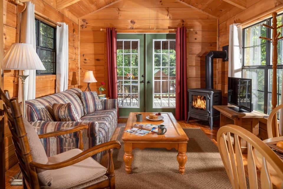 Living area inside Smoky Mountains Cabin at Engadine Inn and Cabins. Living area inside Smoky Mountains Cabin at Engadine Inn and Cabins.